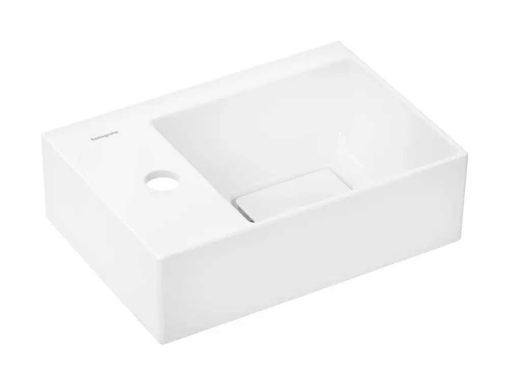 Weißes Handwaschbecken mit rechteckiger Form, Hahnloch links, ohne Überlauf, hergestellt von Hansgrohe. Glatte, leicht zu reinigende Oberfläche.